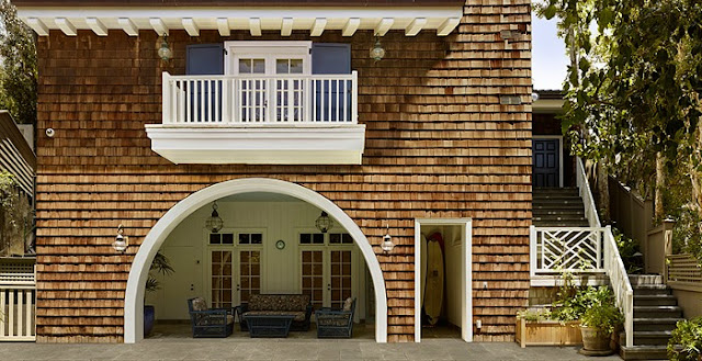 Grace and Frankie beach house exterior with arched opening and shingles