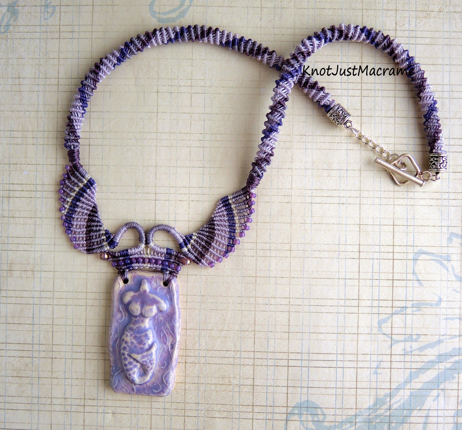 Micro macrame necklace by Sherri Stokey with mermaid ceramic pendant by Gaea.