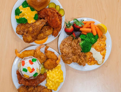 Plates of Golden Corral's Butterfly Shrimp and Chicken Tenders.