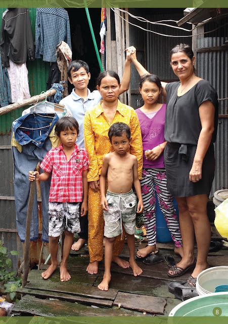 Ermine Norodom with the people in the slum