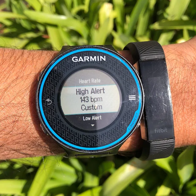 Garmin watch with high heart rate alert set at 143 bpm.