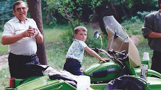 One of the local motorcycles with sidecar being enjoyed by the son of a Moldovan employee