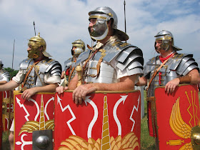 Reenactors from Legion III Cyrenaica with the armor and shields of a Roman legion.