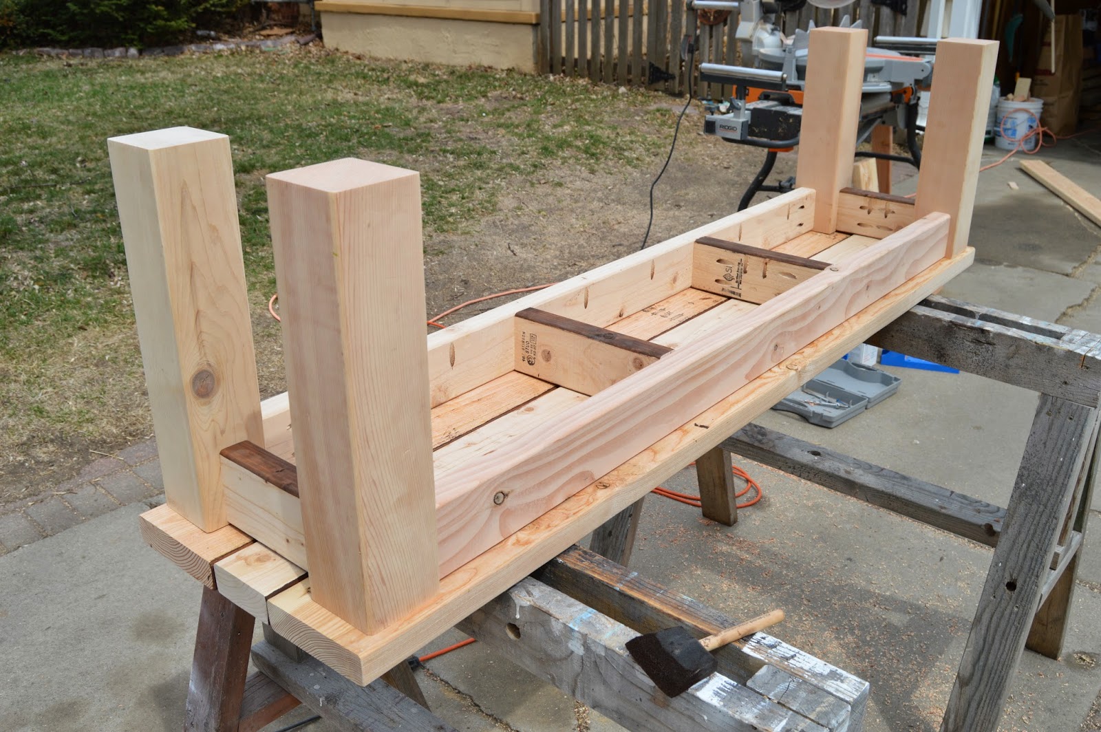 Once both sets of legs are attached, set the bench down to verify it 