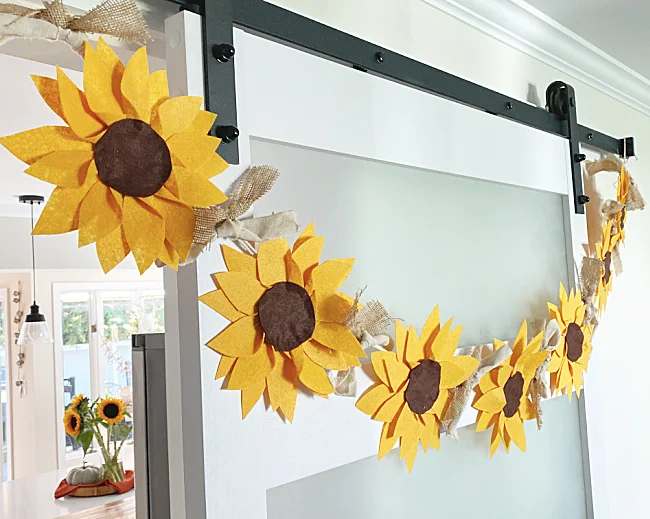 row of sunflowers on door