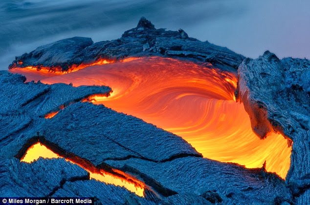 http://www.dailymail.co.uk/news/article-2530412/Incredible-pictures-taken-just-one-metre-away-erupting-volcano-photographer-forced-flee-avoid-hit-lava.html