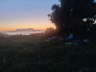 Sleeping stuff at a tree with view to the rock of Gibraltar in the morning dawn