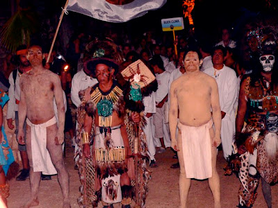 Mayan leaders head up the procession of villagers attending the opening 