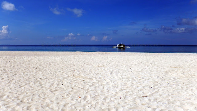 white sand, blue sea and blue sky at Kalanggaman Island