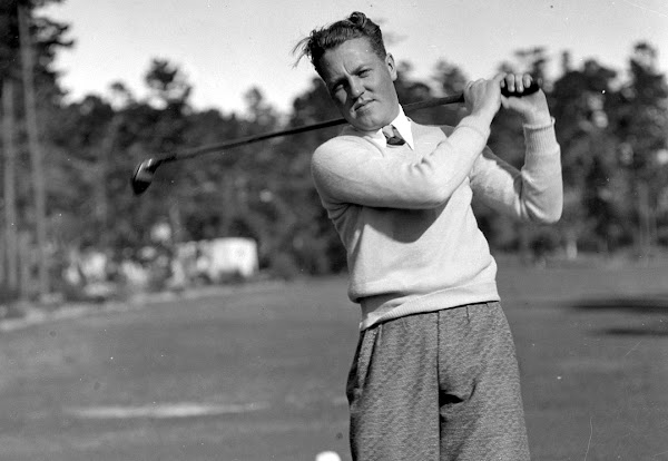 Golfer Johnny Dawson swings a club