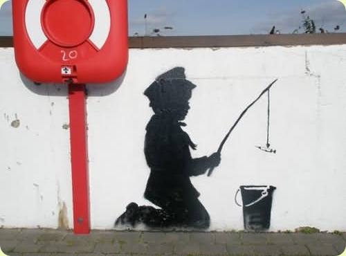 banksy graffiti artwork. Banksy is a well-known English