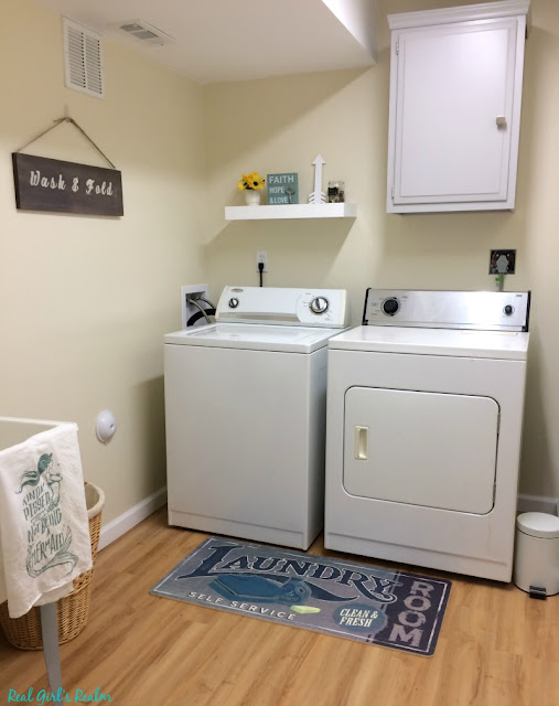 See how we took an ugly basement and turned it into a bright and cozy retreat along with adding laundry, bathroom, and mudroom spaces! Learn money saving tips and tricks from a DIYer.