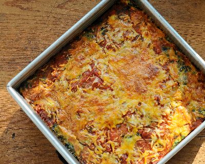 A pan of Easy Make-Ahead Breakfast Casserole, a master recipe ♥ KitchenParade.com. Start with eggs, frozen hash browns, salsa and cheese, then adapt as you like, incl on-the-go muffins and individual ramekins.