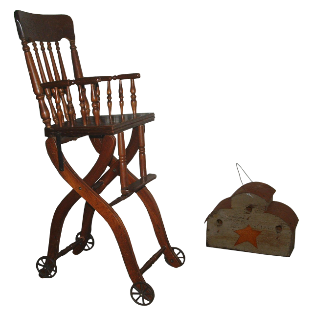 Late Victorian period wooden high chair that's missing it's tray, but does have the old iron wheels on both front and back legs.