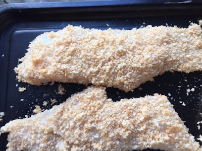 raw cod covered in breadcrumbs