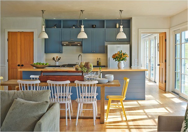 Modern farmhouse kitchen with blue painted cabinets and rustic wood doors found on Hello Lovely