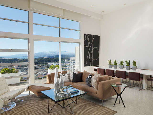 Picture of the dining table behind the sofa in the living room