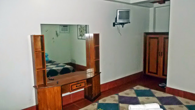 the dresser, a small old TV overhead and a wardrobe cabinet inside a room at Haven of Fun Resort in San Antonio, Dalupiri Island, Northern Samar