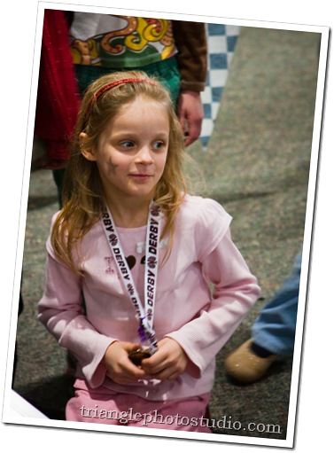 Pinewood Derby - Sophia expression during the winning run.