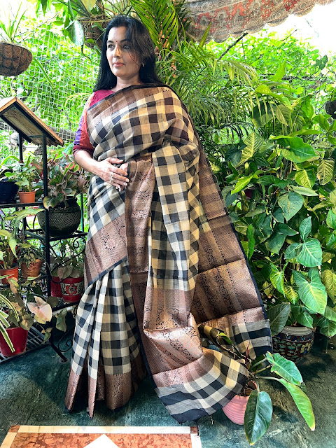 Black madras check Kanchi cotton with antique style zari border and pallu.