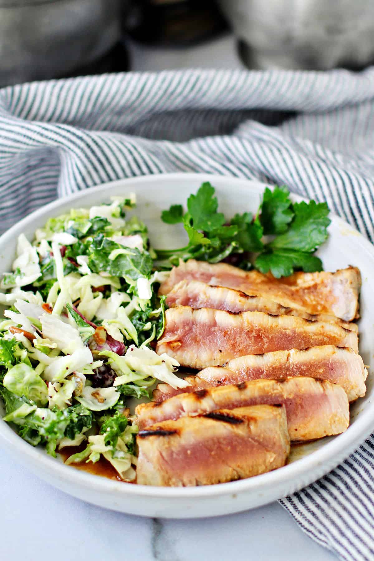 Grilled Tuna Steaks with Honey Vinaigrette in a serving bowl.