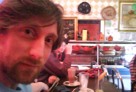 Stuart Brown ('Nick') beams at his proximity to an array of hanging sombreros