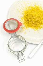Lemon zest filling the jar