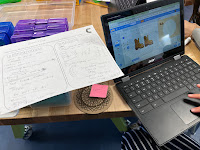 Student prototyping in Scratch and using partner interview notes to guide design.