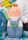 http://www.redheart.com/free-patterns/baby-doll-toy-blanket