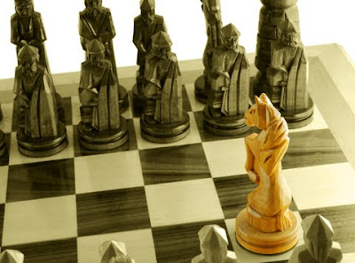 Picture:  Chessmen on a board, but one standing out as distinctive