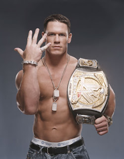 John Cena pose with his WWE belt