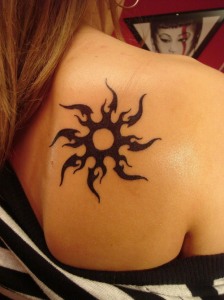 Tribal Sun Tattoos for girls shoulder back for unique look of their body.