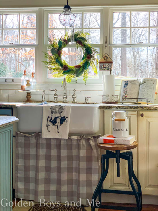 Farmhouse sink in cottage style kitchen with DIY sink skirt - www.goldenboysandme.com