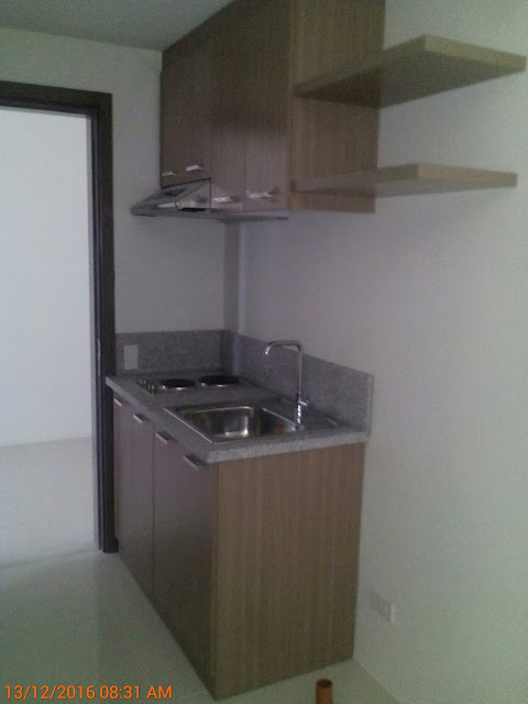 The completed installed kitchen cabinet with plumbing fixtures