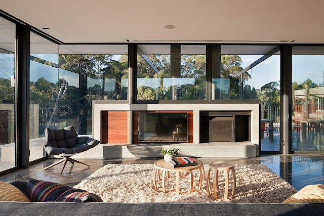 Soft Fabric Sofa, Fur Rug, Light Wood Round Coffee Table, Grey Armchair and Fireplace