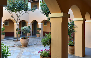 the outdoor space of a village hotel crete