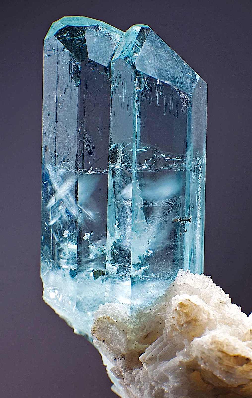 an aquamarine crystal formation in a color photograph, beautiful stones