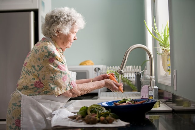 older woman washing her food