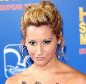 Ashley Tisdale loose fitting updo hairstyle.