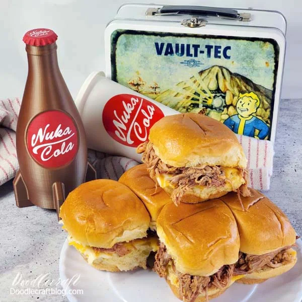 Check out these posts on making the Vault-Tec Lunchbox and the Nuka Cola Rocket Bottle!    Ingredients Needed for Scorchbeast Sliders:  Just Meats Texas Pulled Pork Brioche Slider Rolls Sliced Cheese