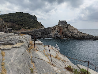 Cliff trails below Castello Doria - looking at the Church of San Pietro and Grotta Byron