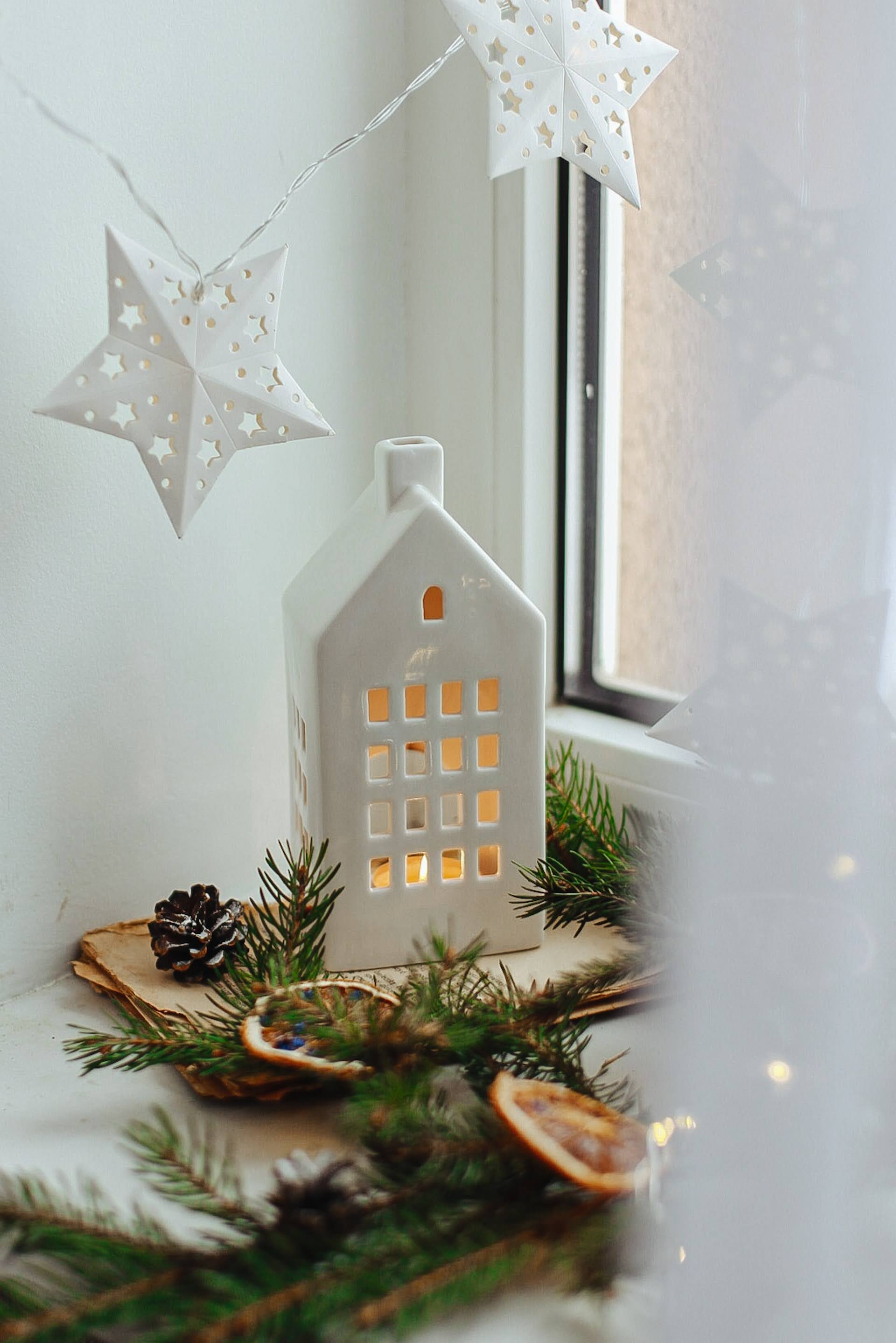 Fairy Lights and White Ceramic House | Photo by Olesia Hnatkevych via Unsplash