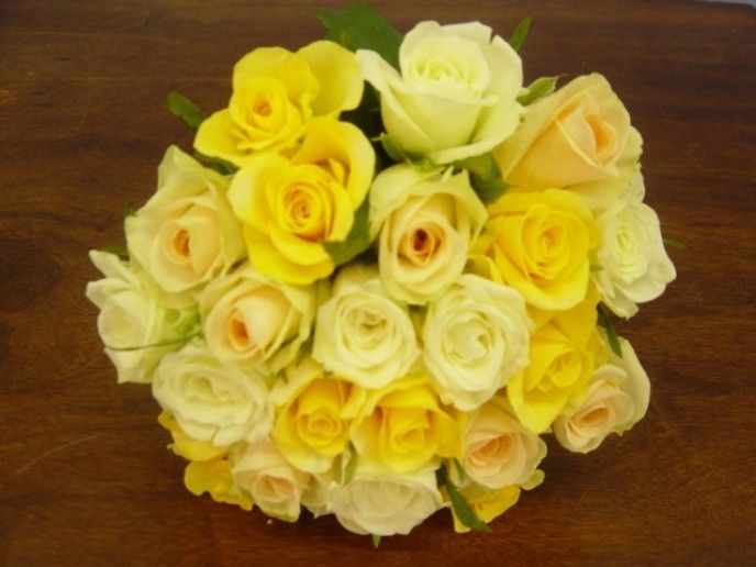 Simple but striking bridal bouquet containing soft yellow bright yellow and 