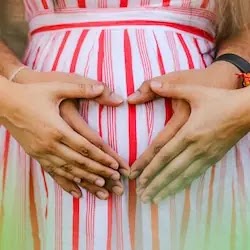 couple touching belly because gynecology