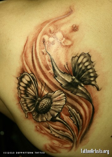 Butterfly Tattoos on women's upper back