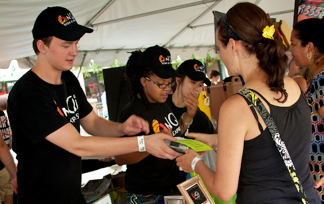 Taste of Downtown in Lansing, Michigan. AnQui Sushi serves food tastings to guests.