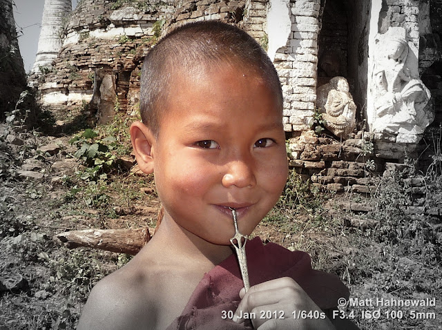 Burma, Myanmar, Inle Lake, young Burmese boy-monk, young Buddhist monk, people, street portrait, maroon robe, Burmese boy, focal black and white