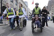 . injured by one of two bombs exploded during the 117th Boston Marathon . (littleboywheechairboylstonstreetbostonmassacreapr ap)