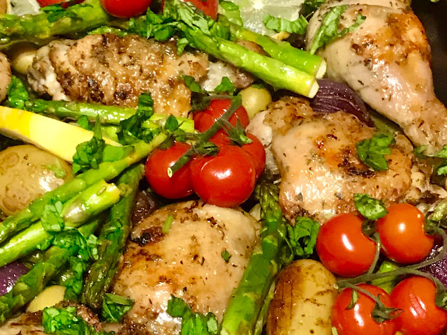 Greek herby chicken tray bake with asparagus, tomatoes, potatoes and red onion