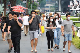 Experts say that surgical masks can help reduce the spread of the virus and are more practical for the general public to use.
